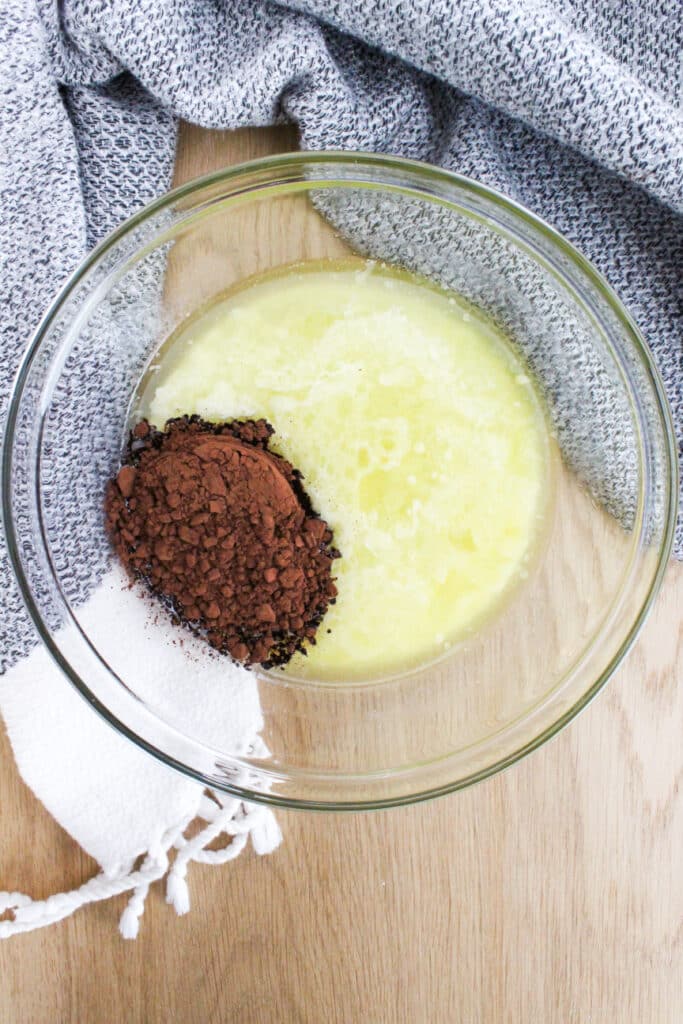 Melted butter and cocoa powder in a bowl