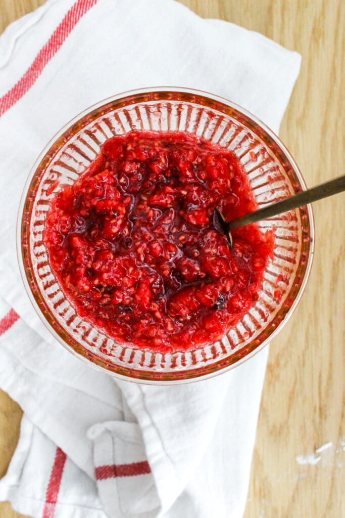 mashed raspberries in a bowl