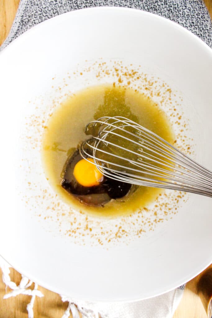 Adding eggs and vanilla to make Salted Caramel Cake